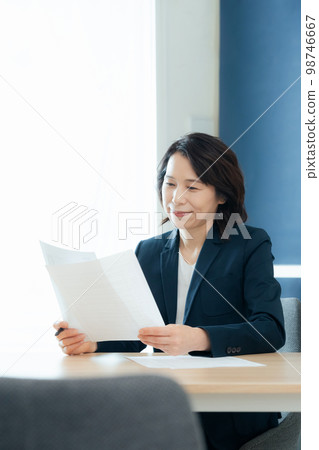 Personnel officer looking at application documents 98746667