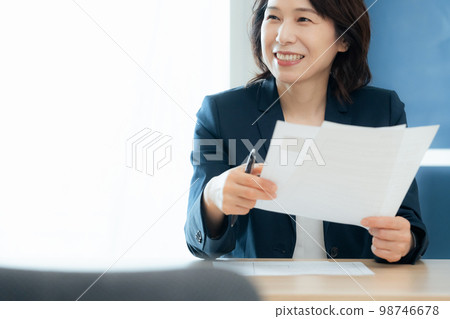 Personnel officer looking at application documents 98746678