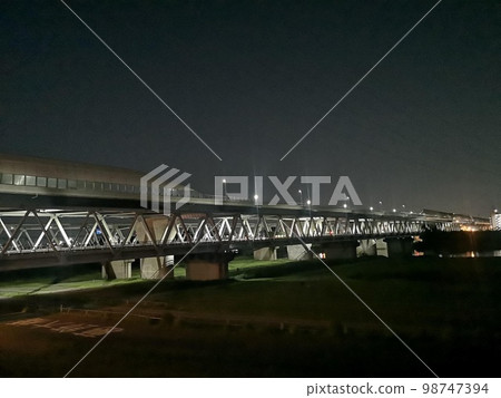 Night view of Katsushika Bridge connecting Kanamachi in Tokyo and Matsudo in Chiba 98747394
