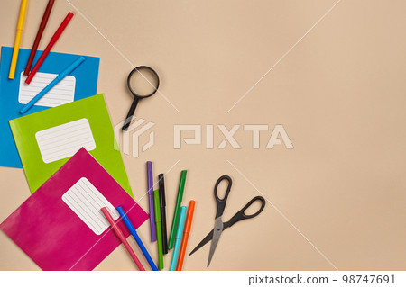 Flat lay photo of workspace desk with school accessories or office supplies. Flat lay photo of workspace desk with school accessories or office supplies. 98747691