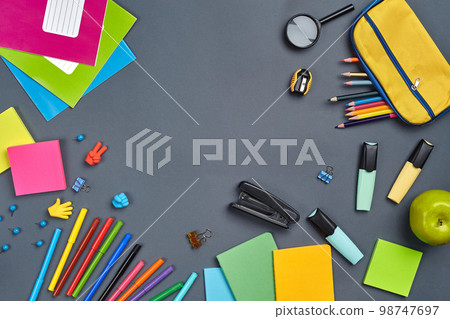 Flat lay photo of workspace desk with school accessories or office supplies. Flat lay photo of workspace desk with school accessories or office supplies. 98747697