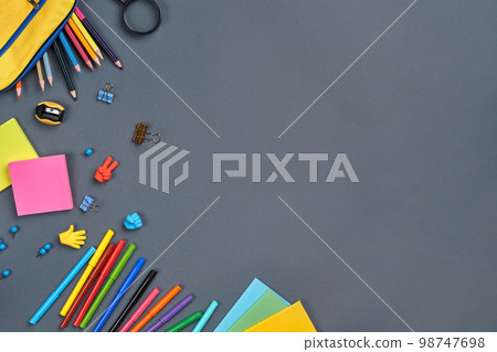 Flat lay photo of workspace desk with school accessories or office supplies. Flat lay photo of workspace desk with school accessories or office supplies. 98747698