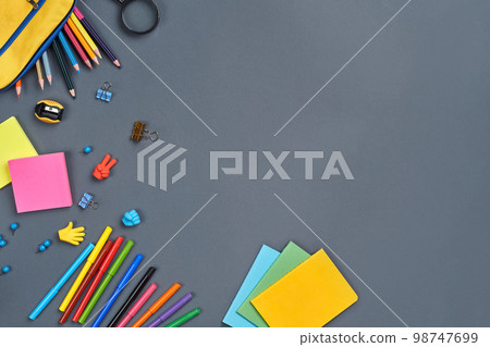 Flat lay photo of workspace desk with school accessories or office supplies. Flat lay photo of workspace desk with school accessories or office supplies. 98747699