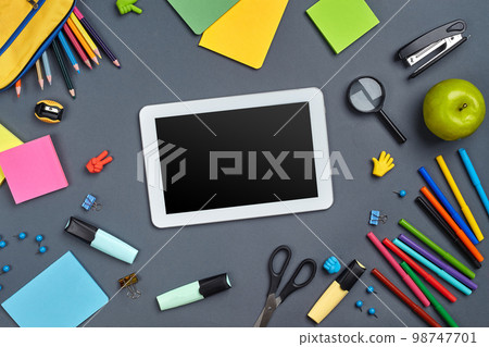 Flat lay photo of workspace desk with school accessories or office supplies. Flat lay photo of workspace desk with school accessories or office supplies. 98747701