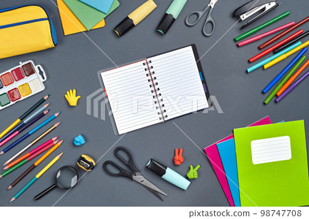 Flat lay photo of workspace desk with school accessories or office supplies. Flat lay photo of workspace desk with school accessories or office supplies. 98747708
