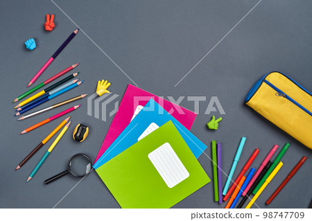 Flat lay photo of workspace desk with school accessories or office supplies. Flat lay photo of workspace desk with school accessories or office supplies. 98747709
