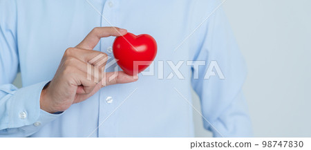 man hand holding red heart shape. love, donor, world heart day, world health day and Insurance concepts man hand holding red heart shape. love, donor, world heart day, world health day and Insurance concepts 98747830