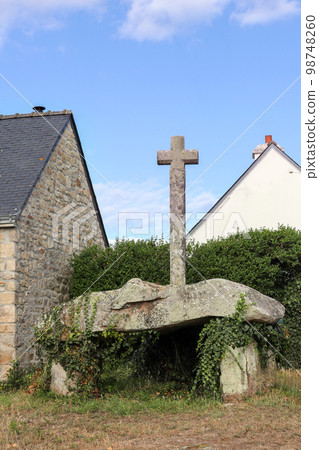 Dolmen Cruz-Menquen in Carnacu in Brittany with a christian cross 98748260