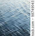 Water surface with ripples 98749043