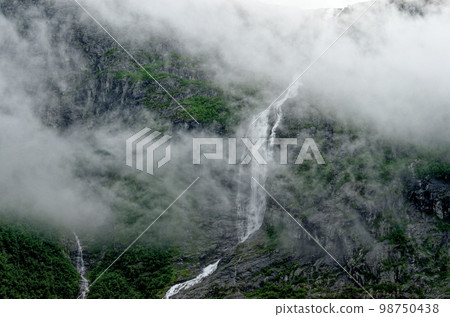 Travel destination Norway - Waterfall - Jostedalsbreen National Park Travel destination Norway - Waterfall - Jostedalsbreen National Park 98750438