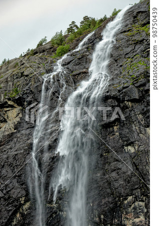 Travel destination Norway - Waterfall - Jostedalsbreen National Park 98750439
