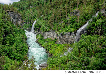 Travel destination Norway - Waterfall - Jostedalsbreen National Park Travel destination Norway - Waterfall - Jostedalsbreen National Park 98750449