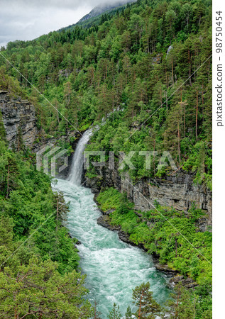 Travel destination Norway - Waterfall - Jostedalsbreen National Park 98750454