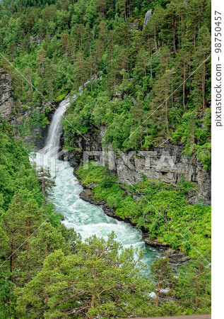 Travel destination Norway - Waterfall - Jostedalsbreen National Park Travel destination Norway - Waterfall - Jostedalsbreen National Park 98750457