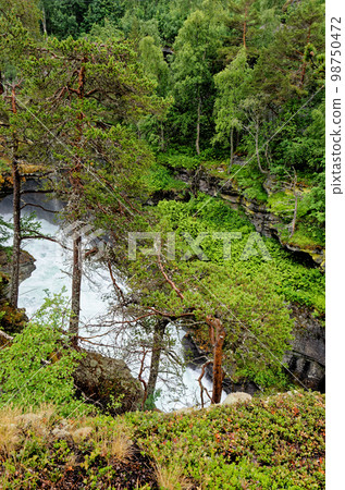 Travel destination Norway - Waterfall - Jostedalsbreen National Park Travel destination Norway - Waterfall - Jostedalsbreen National Park 98750472