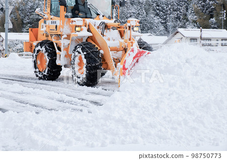 Snow removal dozer Road snow removal work in progress 98750773