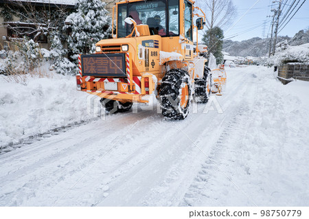 Snow removal dozer Road snow removal work in progress Snow removal dozer Road snow removal work in progress 98750779