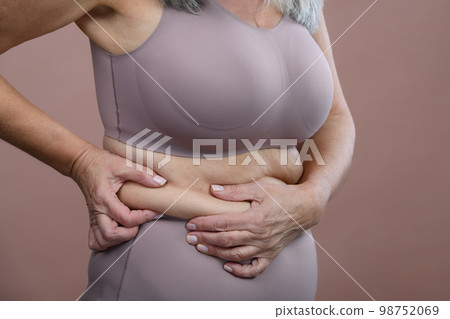 Close-up of senior woman body, studio shoot. 98752069