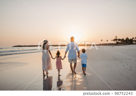 Happy family with little kids enjoying time at sea in exotic country. 98752243