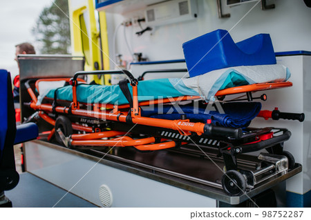 Close-up of empty stretcher inside ambulance vehicle. 98752287