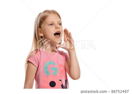 Close-up portrait of a nice blonde little kid in a pink t-shirt posing isolated on white background. Close-up portrait of a nice blonde little kid in a pink t-shirt posing isolated on white background. 98752497
