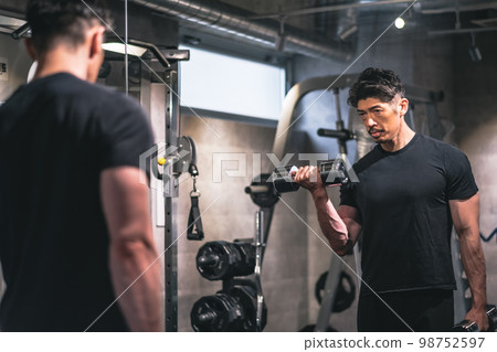 man doing strength training at the gym man doing strength training at the gym 98752597