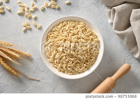 Cooking homemade pasta Cavatelli with rolling pin. 98753068