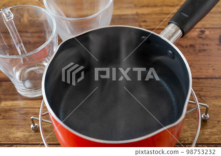 Hot water made in a pot and cooled 98753232