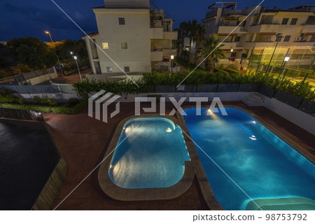 illuminated swimming pools at night 98753792