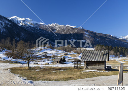 Typical landscape with wooden log cabins near Bohinjska Bistrica, Triglavski national park, Slovenia 98753805
