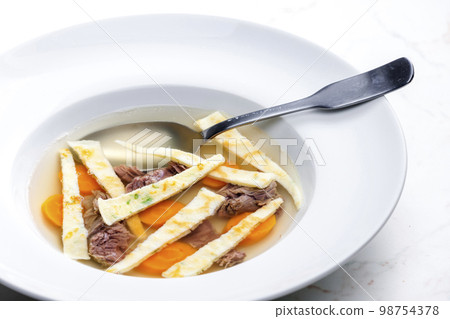 beef soup with celestine noodles and carrot 98754378