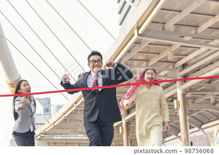 Business competition group of business people in formal suit run to finish line success goal victory strategy. Competitive person race to be first place winner. Multiethnic diversity people contest. 98756068