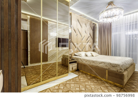 Luxury bedroom interior with parquet and mirror walls 98756998