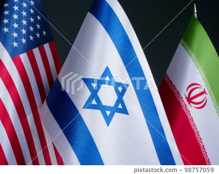 Near the flags of the USA and Israel, the flag of Iran in the distance. 98757059