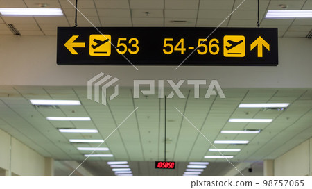 Boarding gate sign in airport. Airport Departure information board sign in terminal at airport. Boarding gate sign in airport. Airport Departure information board sign in terminal at airport. 98757065