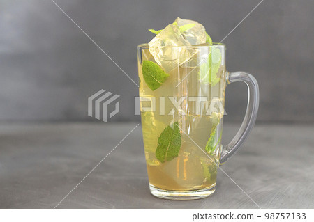 Cooling drink with ice and mint. Glass of cold drink. Copy space 98757133