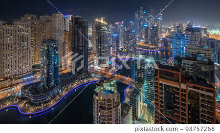 Panorama showing various skyscrapers in tallest recidential block in Dubai Marina aerial night 98757268