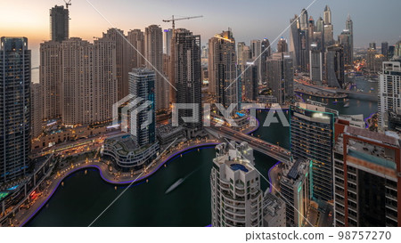 View of various skyscrapers in tallest recidential block in Dubai Marina aerial day to night 98757270