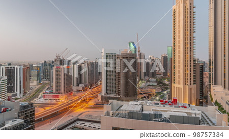 Skyscrapers at the Business Bay in Dubai aerial night to day , United Arab Emirates Skyscrapers at the Business Bay in Dubai aerial night to day , United Arab Emirates 98757384
