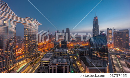Futuristic Dubai Downtown and finansial district skyline aerial night to day . 98757465