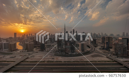 Sunset over panoramic skyline of Dubai with business bay and downtown district . 98757630