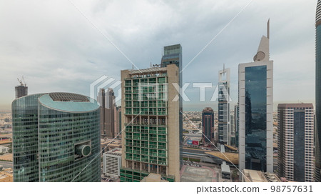Panorama showing Dubai international financial center skyscrapers with promenade on a gate avenue aerial . 98757631
