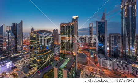 Dubai international financial center skyscrapers aerial day to night . 98757648