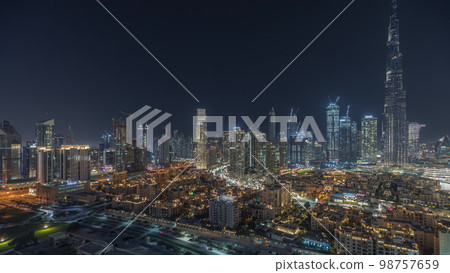 Panorama showing Dubai Downtown and business bay night with tallest skyscraper and other towers 98757659