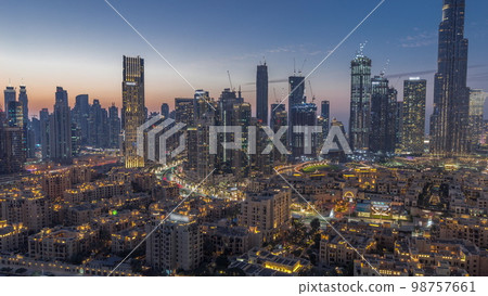 Dubai's business bay towers aerial day to night . Rooftop view of some skyscrapers 98757661