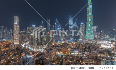 Dubai Downtown night with tallest skyscraper and other towers 98757673