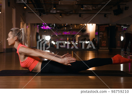 Urdhva mukha shvanasana pose. Young attractive woman practicing yoga, standing in upward facing dog exercise. Urdhva mukha shvanasana pose. Young attractive woman practicing yoga, standing in upward facing dog exercise. 98759210