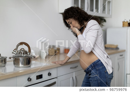 Morning Sickness. Young Pregnant Woman Suffering From Nausea At Home Morning Sickness. Young Pregnant Woman Suffering From Nausea At Home 98759976