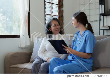 Home healthcare nurse, physical therapy with senior adult woman at home 98760365