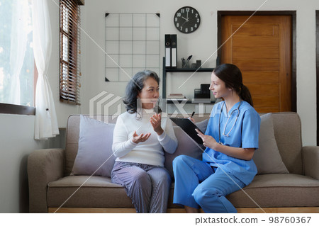 Home healthcare nurse, physical therapy with senior adult woman at home 98760367